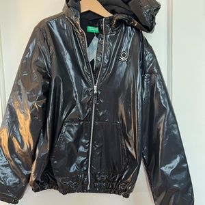 Shiny black Benetton jacket with light fleece inside. Size 10-12.